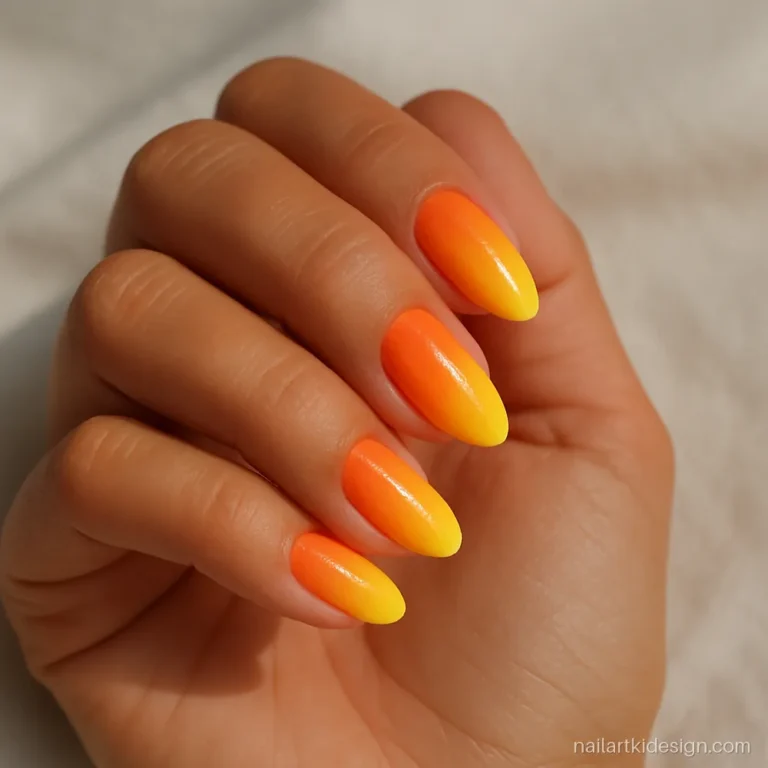Sunset gradient nails fading from orange to yellow made with a kitchen sponge