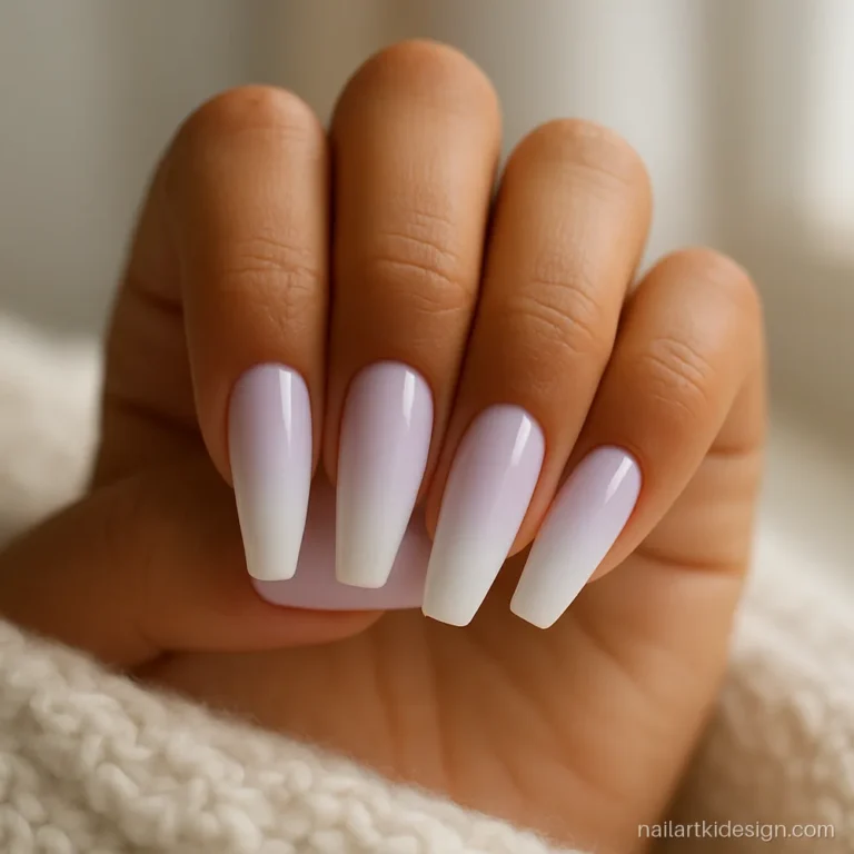Lilac French ombre nails blending into white on long coffin nails