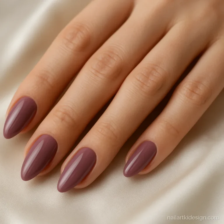 Almond nail shape on medium nails painted in mauve