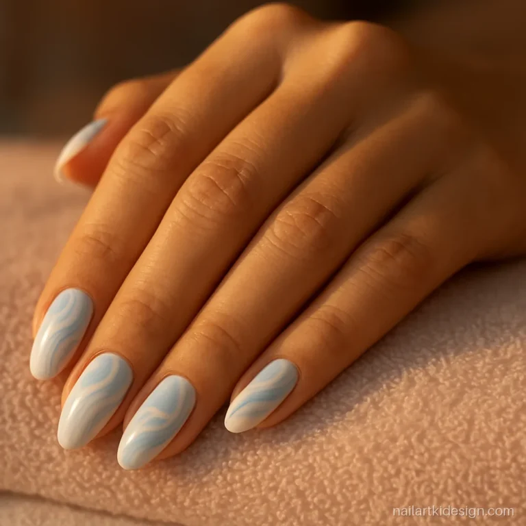 Gel nail art with blue and white swirl patterns on medium almond nails