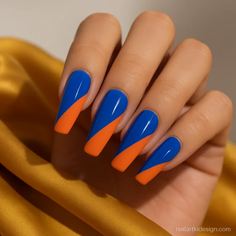 Cobalt blue and orange nail art for deep skin on coffin nails