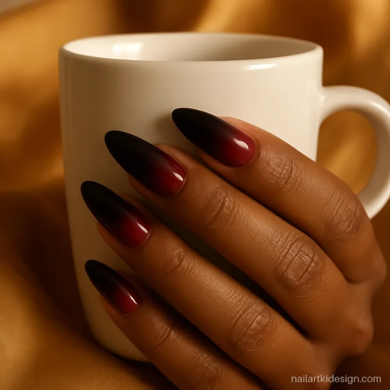 Black and red nail polish ombre on long almond nails