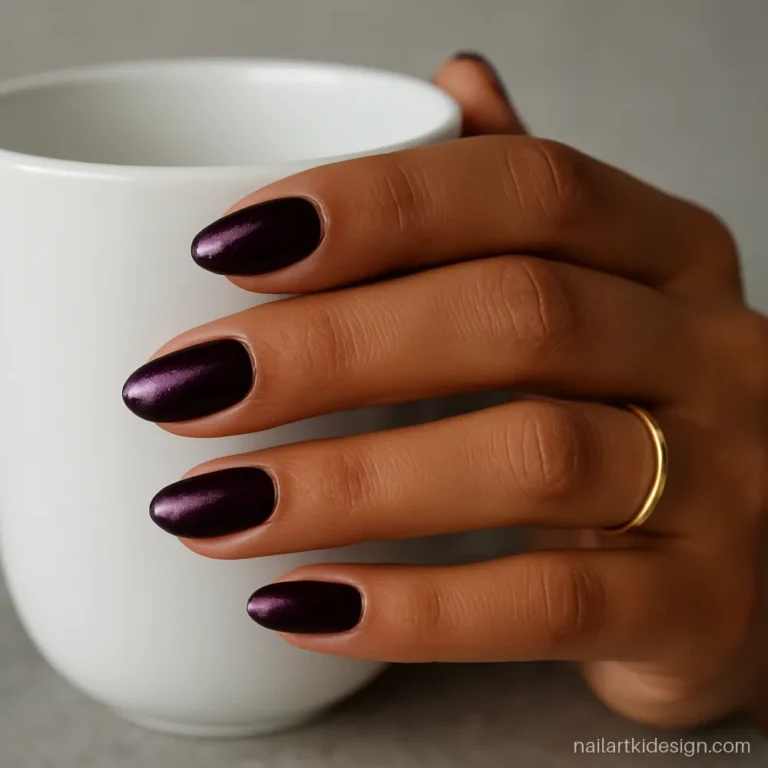 Winter nails in deep plum with a soft velvet cat eye shimmer