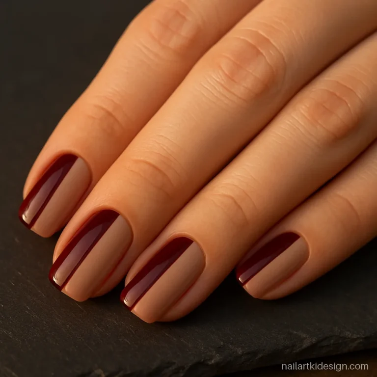Two colour nail art with half maroon and half nude blocks on each nail